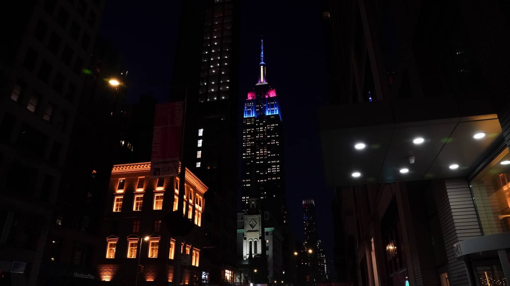 The Empire State Building lit up at night in WSF brand colors. [Credit: Bryan Smith]